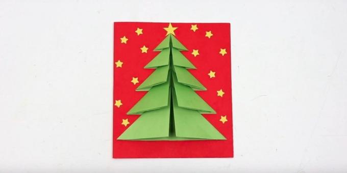 Cartolina di Natale con l'albero di Natale sulla copertina del volume di