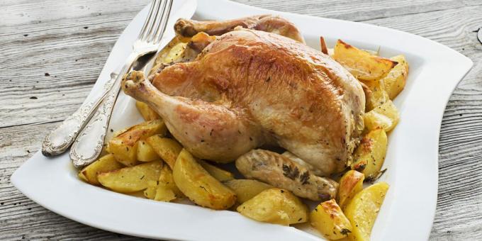 Pollo intero con patate e origano al forno